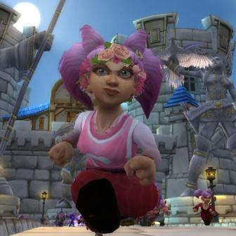 A World of Warcraft gnome with pink hair and a crown of pink flowers running towards the camera with a determined look on her face